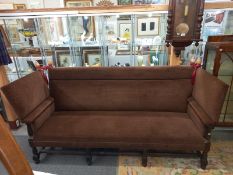 An early 20th century double knoll end settee. COLLECT ONLY.