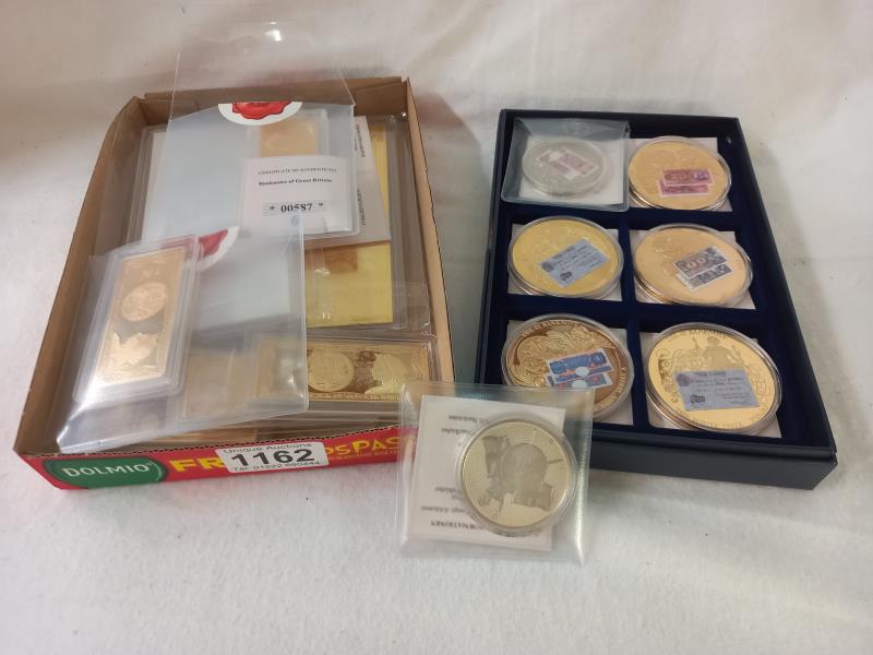 7 British bank note coins in case, 5 gold plated GB bank notes and 3 plated German bank notes.