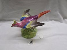 A large Copeland Spode multi-coloured crested pheasant standing with outstretched wings.