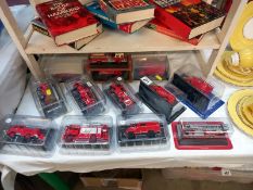 A quantity of Diecast fire engine models in original packaging by various makers.