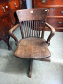 A 1920's oak industrial swivel office chair. Collect only.