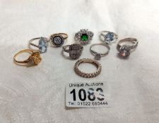 A quantity of silver dress rings - Sizes T, U & V