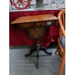 A Victorian mahogany sewing table.