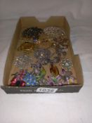 A mixed lot of sparkly brooches.