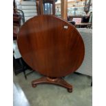 A Victorian mahogany tip up dining table. COLLECT ONLY.