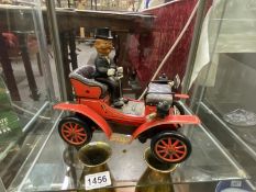 A 1960's tinplate battery operated 1901 Jalopy car. Working when tested.