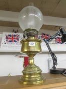 A Victorian brass oil lamp with original acid etched shade. COLLECT ONLY.