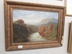 A late Victorian oil on canvas rural scene with river and trees.