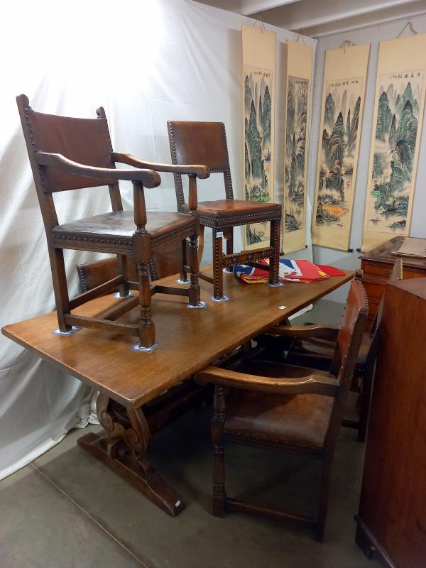 An oak refectory style table with two carvers and four dining chairs, COLLECT ONLY.