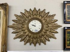 A large Smiths 8 day Sunburst clock. 66.5cm x 48.5cm.