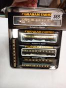 A Graham Farish N gauge 371-626B GWR railcar No 22 shirt button chocolate cream with coaches.