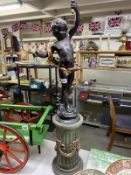 A classical style cherub on plant floor standing lamp.