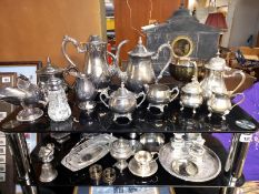 3 silver plated tea sets, small Russian samovar, cruets etc. 2 shelves