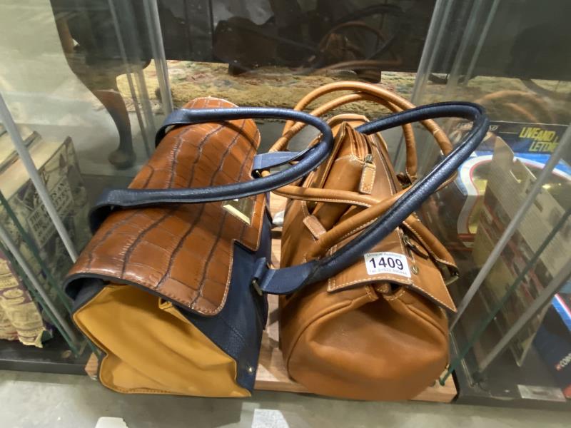 A Fiorelli Brown and Bael leather bag and Fiorelli brown leather bag with matching purse.