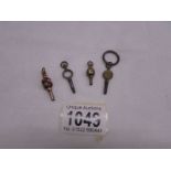 Four old pocket watch keys (one may be gold).