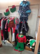 A quantity of fancy dress costumes and a selection of head wear including, Santa, Elf etc. Collect