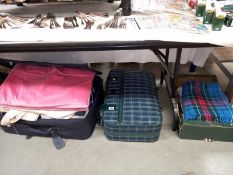 2 large cases and a box of fabrics including picnic rugs, etc.