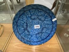A Chinese blue glazed plate, 28 cm.
