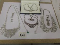 A good lot of diamonte' and other necklaces.
