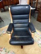 A retro Swedish model Gute-mobler Nassjo teak framed leather swivel chair.