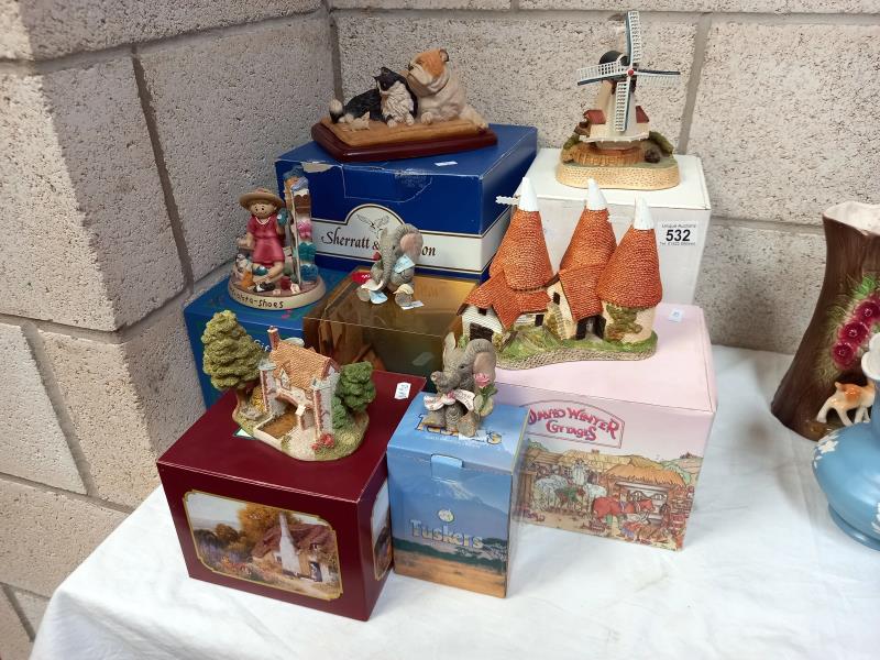 A collection of boxed ornaments including David Winter, Sherratt and Simpson bulldog with cat etc.