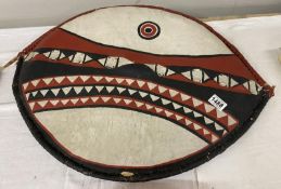 A vintage tribal shield. 71cm x 54cm.