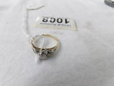 An 18ct gold and diamond ring, size O, 2.7 grams.