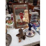 A vintage Beefeater advertising mirror, Pusser's rum ships decanter and heavy brass bar top