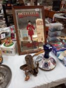 A vintage Beefeater advertising mirror, Pusser's rum ships decanter and heavy brass bar top