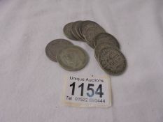 Eleven George V silver half crowns, approximately 152 grams.