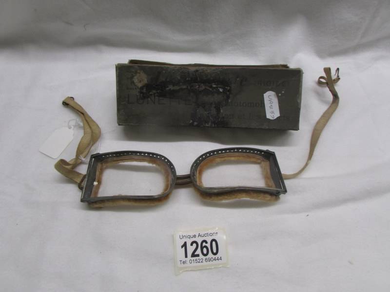 A pair of vintage goggles in original box.