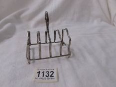 A hall marked silver toast rack, Birmingham 1944, 2.37 ounces.