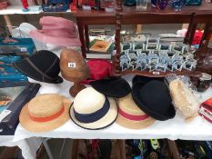A 19th/20th Century mushroom wooden hat stand and a quantity of vintage ladies hats. ( heads not