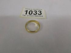 A 22ct gold wedding ring, size O, 3.3 grams.