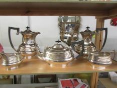 A five piece silver plate tea set.
