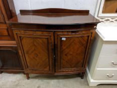A mahogany two door cabinet. COLLECT ONLY
