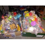 A box of unopened McDonald toys including Peter Pan, Walt Disney & Smurfs etc. & a box full of
