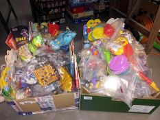 A box of unopened McDonald toys including Peter Pan, Walt Disney & Smurfs etc. & a box full of
