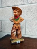 A 1930's Chalk figure of a cowboy child. Height 39cm A/F