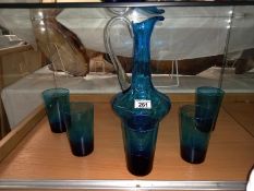 A blue glass jug and five tumblers. Collect Only.