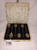 A cased set of six hall marked silver coffee spoons.