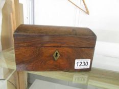 A Victorian oak tea caddy.