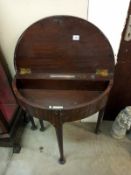 A Victorian mahogany D end, writing/tea table with lift up lid and single drop leaf. 74cm x 40cm x