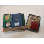 A quantity of coins including proof sets, Churchill crowns etc, and cigarette cards.