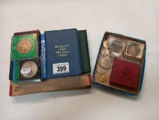 A quantity of coins including proof sets, Churchill crowns etc, and cigarette cards.