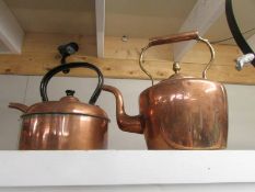 A Victorian copper kettle and one other.