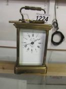 A brass carriage clock.