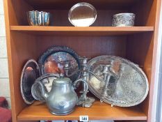 A quantity of silver plate and pewter including candelabra, trays etc. 2 shelves.
