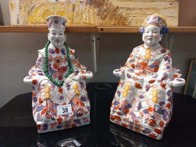 A pair of Chinese seated figures.