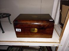 A Victorian mahogany writing box with one inkwell.